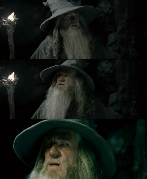 Three film stills stacked vertically show an elderly man with a long white beard, long grey hair, and a tall pointed grey hat in a dark, rocky space. The top still frames him from the chest up, looking slightly upward with his mouth open; a gnarled staff with a small flame sits at the left edge. The middle still is a similar chest-up shot, his gaze shifted and his mouth tighter. The bottom still is a close-up under the hat brim, eyes wide and turned aside, mouth slightly open.