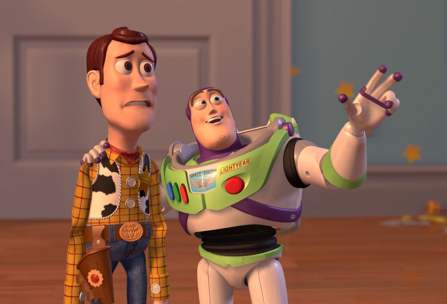 Two animated characters stand side-by-side indoors on a wooden floor. The left character (cowboy outfit, yellow plaid shirt, brown hat hair) has a worried, open-mouthed expression. The right character (green-and-white space suit with purple accents, “SPACE RANGER LIGHTYEAR” on the chest) smiles broadly, has one gloved hand on the cowboy’s shoulder, and raises the other hand with two fingers extended upward in a pointing gesture. A white door and a blue wall with yellow stars are visible in the background.